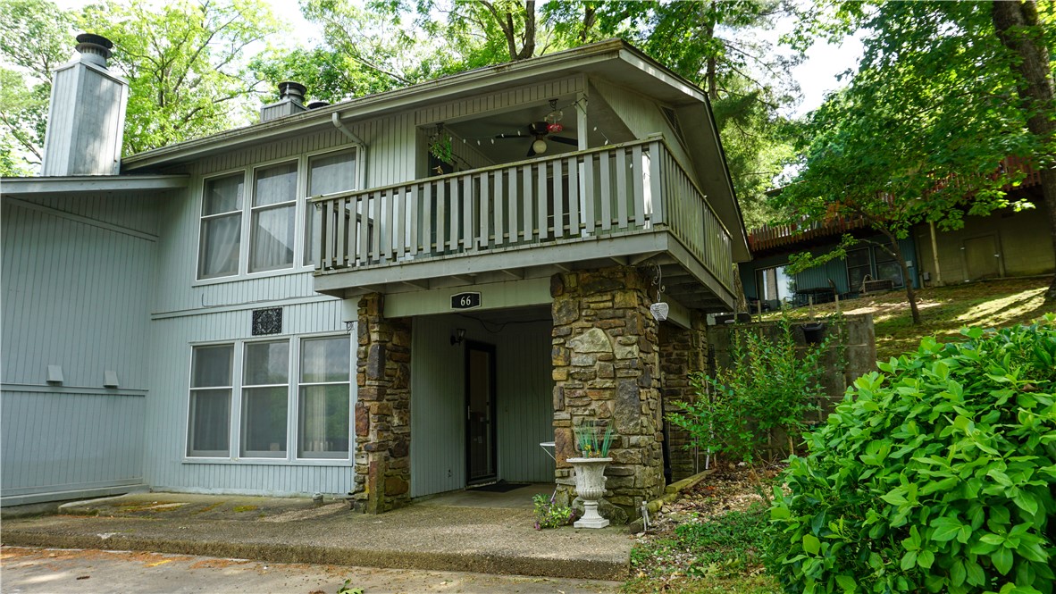 Discover this wonderful retreat in the woods at 66 Dogwood Dr. Being located less than 5 minutes from 71N, This property offers a seamless blend of comfort and convenience.  3 bedrooms/ 2 bath total. 1 bedroom, a cozy kitchen, dining, living area and a covered porch complete the first floor, 2 bedrooms, 1 bath, a dedicated laundry room, living area, and a upper deck with sweeping views of the area fill out the second story. This condominium offers a great opportunity to embrace the Bella Vista lifestyle.