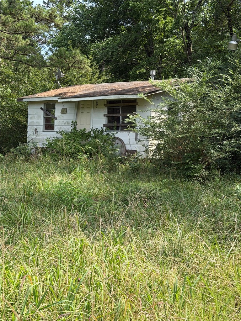 Investment Opportunity Near Lake Dardanelle! Bring your vision to this fixer-upper located on Highway 22 in Dardanelle. Selling AS-IS, offers excellent potential for investors, flippers, or buyers ready to renovate. The location is the true value! Just minutes from Lake Dardanelle boat launches, a nearby golf course, and Mount Nebo State Park, you'll enjoy easy access to boating, fishing, hiking, mountain biking, camping, and breathtaking scenic overlooks. Conveniently located near Dardanelle, Russellville, restaurants, shopping, and schools, this property offers the perfect blend of recreation and accessibility. Whether you're looking for an investment property, rental opportunity, or your next renovation project, this property is full of possibilities. Sold AS-IS. Schedule your showing today and discover the potential of this River Valley property!