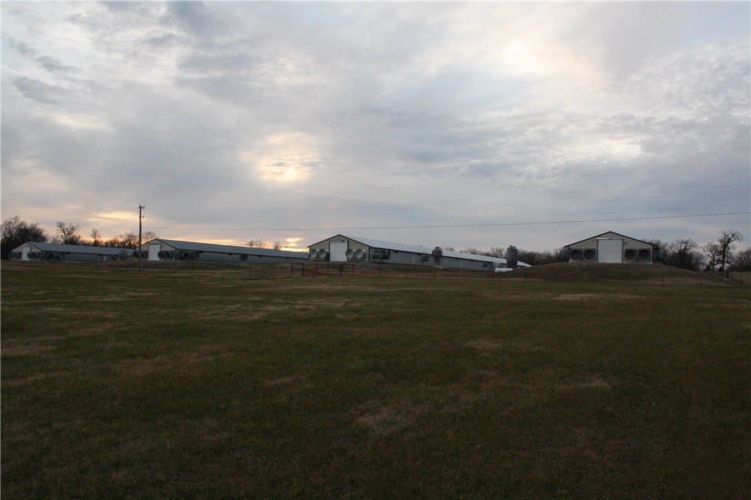 4 house pullet farm on 21.46 acres. Current contract with Cobb-Vantress. Great location/roads, easy to service. This very clean farm has high history performance. All houses retroed in 2014. 3 houses built in 1998 and 1 house new in 2018. All four houses have had new coolcell pads replaced this year. Incinerator only couple years old. Mobile home purchased in 2017 and has warranty till 2022. Annual gross income over $230k. Call regarding showing instructions and biosecurity, agent must be present.