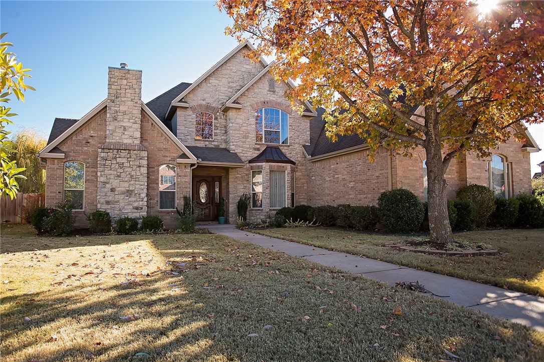 This homes grand entry is flanked by a spacious dining room and cozy formal living with it's own fireplace.  20 foot ceilings give the great room an airy space while the stacked stone fireplace adds warmth and ambiance. Game room over the side entry garage keeps the noise out of the living room.  Downstairs is the master and an additional bedroom with private bath, and a large, functional laundry room. Landscaped back yard includes many evergreens for color all winter.  Fresh paint & New carpet throughout