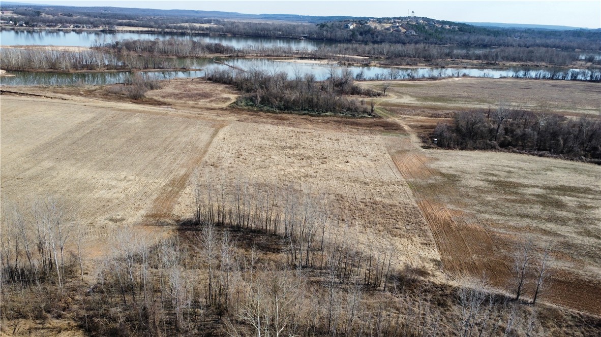 Approximately 68± acres located just west and north of Pinnacle in West Little Rock, Arkansas, offering a rare combination of recreational, agricultural, and riverfront features. The property includes approximately 7± acres of bottomland hardwood timber on the west side, with a duck blind that is subject to seasonal flooding.

Approximately 525 feet of frontage along the Arkansas River (Palarm Pool), providing river access and exceptional wildlife habitat. The remaining acreage is previously tillable ground that is currently enrolled in a CRP tree planting program (2024), which provides annual payments to the seller.

Ideally situated between Roland, Arkansas and the Arkansas River, this property is located in an excellent deer hunting area, with opportunities for occasional duck hunting when weather and water conditions allow. A unique opportunity for investors, outdoorsmen, or buyers seeking recreational land with Arkansas River frontage, all within close proximity to West Little Rock.