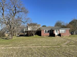 Looking for a Spacious home with 3 acres, just outside of Russellville? Schedule your appointment today. A Large living area and kitchen on the main floor,  A smaller kitchen and living area downstairs that would make a great man cave,  a large wrap around deck, and 3 acres to room on are just some of the features that you'll enjoy with this home.
