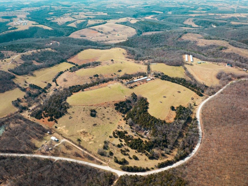 Beautiful acreage! The owner is currently having this land surveyed. About a 1/2 mile from Table Rock Lake. There is a mobile home on the property that we are not giving any value. There is a well, the pump needs to be replaced. The pasture is being rented for hay.