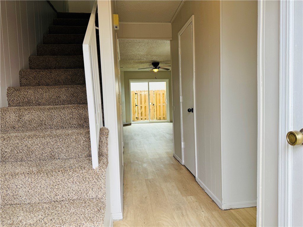 Spacious 2-bedroom 1.5 bath townhouse in Springdale featuring a large living room and a walk-out fenced patio. Convenient layout with a half bath downstairs and washer/dryer hookups for added ease. Fireplace in living room is covered up and no longer exist. Tenants will have a $45 water fee charged to tenant account every month. We process applications as we receive and once an application is approved, we reach out for deposit. Deposit secures the unit not the application. Please be aware of scams. Our application process is to be paid online through a secure portal and we do not accept cash, CashApp, Venmo, and/or PayPal. Showings are through appointments only. Tenants responsible for all utilities. Pictures are of like unit - some layout, finishes may vary.