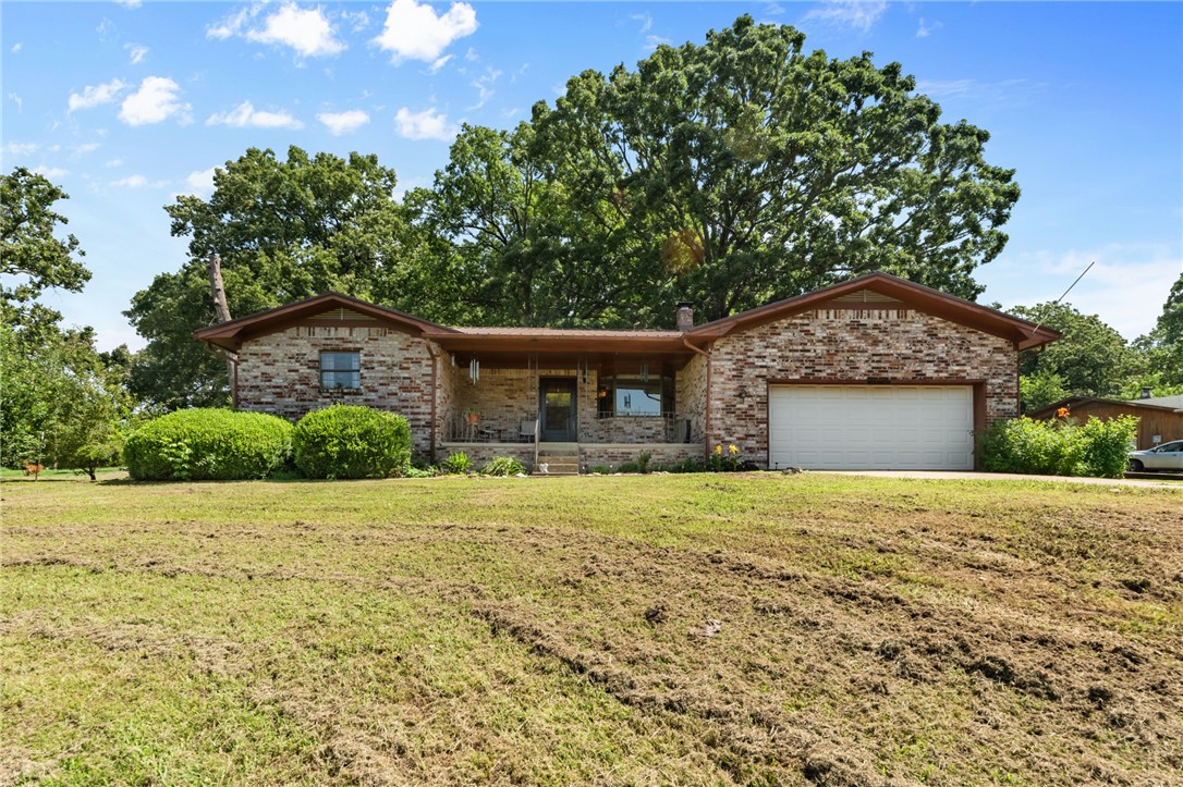 This is a 3 bed 2 bath brick home outside of Harrison, it offers a rural setting and also the convenience of a short commute to town! Featuring bearing fruit trees in the front yard and a spacious backyard- An added bonus is new fiber optic internet, providing fast, reliable connectivity for working from home, streaming, or staying connected. This is a great place to roam and enjoy the beauty of the Ozarks.