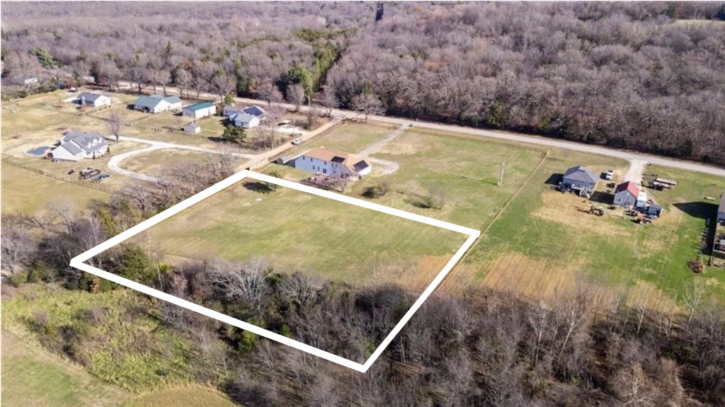 Discover the perfect blend of country living and convenience with this beautiful 2.5-acre property. Nearly all of the land has been cleared, providing a ready-to-build homesite with plenty of space for your dream home, shop, garden, or hobby farm. Public water and electricity are available at the street, making development even more convenient. Enjoy peaceful rural surroundings, scenic views, and room to spread out while still being just 30 minutes from the University of Arkansas and all the shopping, dining, entertainment, and amenities Fayetteville has to offer. Whether you're looking to build now or invest for the future, this property offers the ideal combination of privacy, usability, and accessibility.