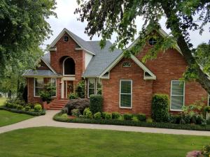 BEST VIEWS IN RIVER VALLEY! Every morning imagine sitting under the covered deck overlooking PANORAMIC views of Lake Dardanelle & experience blissful sunrises. This custom, solid built 1 owner home is polished, well maintained & immaculately landscaped! Inside this elegant home you'll notice a floorplan designed for the impeccable views. 9 & 10ft ceilings throughout this 3720sqft residence. A central vac system makes for easy cleaning. Formal dining room, living & kitchen w/pantry are designed to appease large gatherings.Master suite boasts of elegance & has spacious bath w/seperate vanities. Up grand staircase are 2 bds both w/exceptional views. Downstairs is a finished basement w/living area, 4th bdrm/bath, & in-home shop/garage (very convenient). It is possible to live like on vacation!