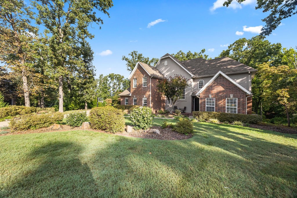 Nearly an acre lot on a quiet cul-de-sac in desirable Stonehenge S/D. This home is move-in ready and built to last. Several high quality updates in 2025 including New Roof with Class 4 Shingles (may qualify for insurance savings!), Gutters, Both HVAC Systems, Air Ducts and Dryer Vent clean out, Interior Paint, New Insulated Garage Doors, and Refreshed/Updated Landscaping.  Plus, new Water Heater and Carpet Replaced in 2024. Home consists of 4 bedrooms, 3 1/2 baths, an office or 2nd living area, large gourmet kitchen. Hardwood flooring on main level. Updated master bath. Private deck overlooking the large wooded lot! Unbeatable location just 3 miles from Coler Mountain Bike trail and minutes from Crystal Bridges, Walmart home office and downtown Bentonville. This home offers peaceful suburban living with quick access to Bentonville's best.