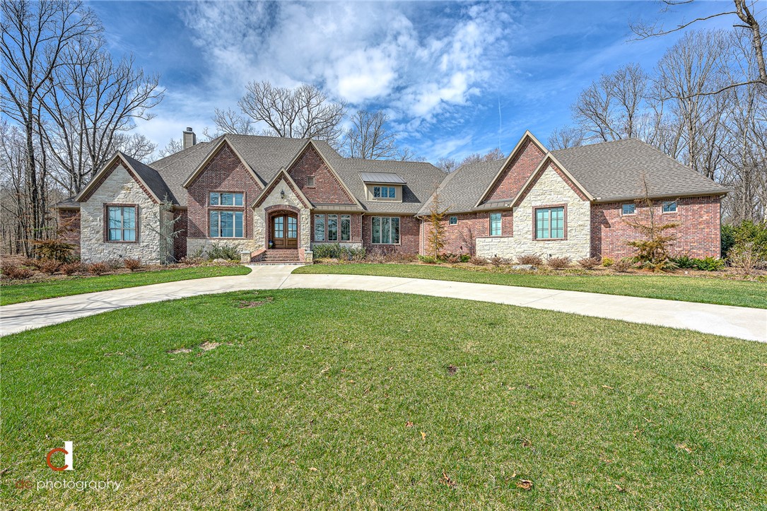 Stunning Home in East Fayetteville on over 8 Acres! Just 25 minutes to Downtown Fayetteville, enjoy secluded living in nature with all the beautiful views that Goshen has to offer. Breathtaking features of this home will greet you as you arrive, including the 18' cathedral ceilings. Immaculate and better than new, no detail has been missed. From oversized walk-in closets, to carefully designed storage and pantries, this home is as custom as it gets! The master suite is incomparable with a brick accent wall, remote window shades, a luxury bathroom, dreamy closet, and exercise room to accommodate every need... and the closet connects to the spacious laundry room with a built in dog kennel. The cedar wrapped screened in porch boasts a 22' vaulted ceiling for year-round relaxation and nature viewing. Epoxy garage flooring, professional landscaping & sprinkler system. Too many details to list- MUST SEE!  Bonus: Ozarks go internet allows for a carefree work from home environment in a grand office with 14' ceilings.