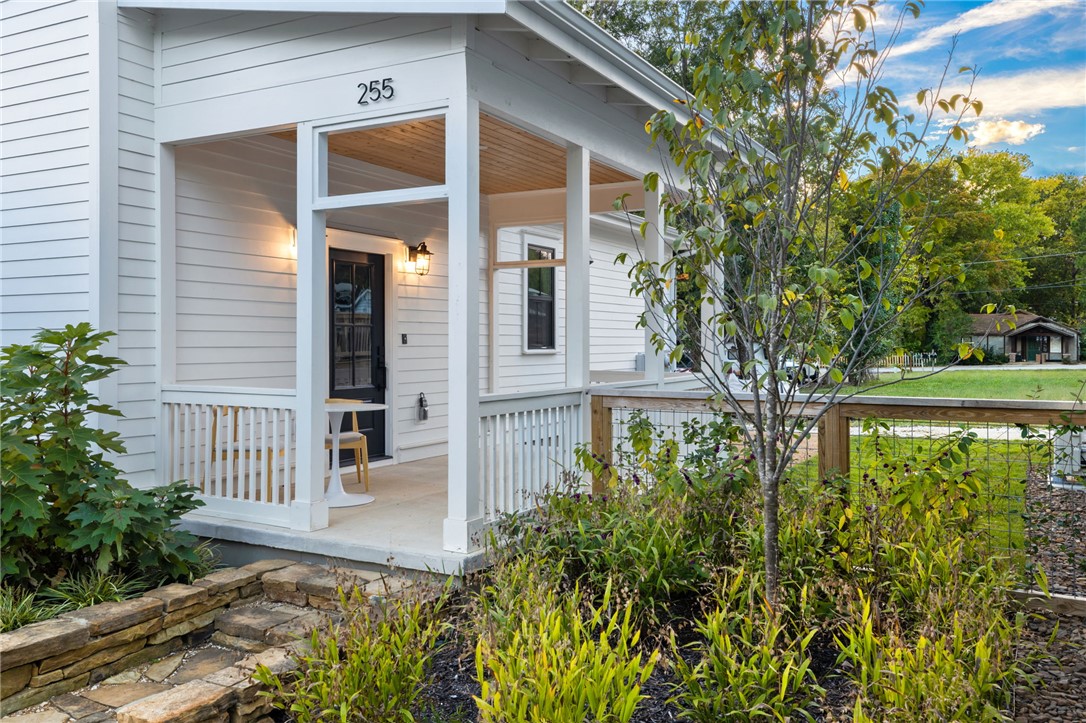 Live lightly, beautifully, and close to everything in this Net Zero cottage. Set within the 11th Street Cottages community and surrounded by native gardens, this home offers rare build quality, energy performance, and thoughtful design at a price point under $400K in Fayetteville. Designed for privacy and connection, the neighborhood offers peaceful private living along with shared green space, native garden, and welcoming front porches that create natural places to gather. Inside, natural light fills an open floor plan with tall ceilings, custom cabinetry, quartz counters, designer finishes, induction cooking, and flexible spaces for guests, work or creativity. Professionally maintained native landscaping through the POA keeps the setting beautiful and low-maintenance. With fully owned solar panels, Energy Star systems, and HERS-rated efficiency, this home is built for long-term comfort, sustainability, and lower utility costs by Walker Park, the Razorback Greenway, restaurants, shops, and downtown Fayetteville.
