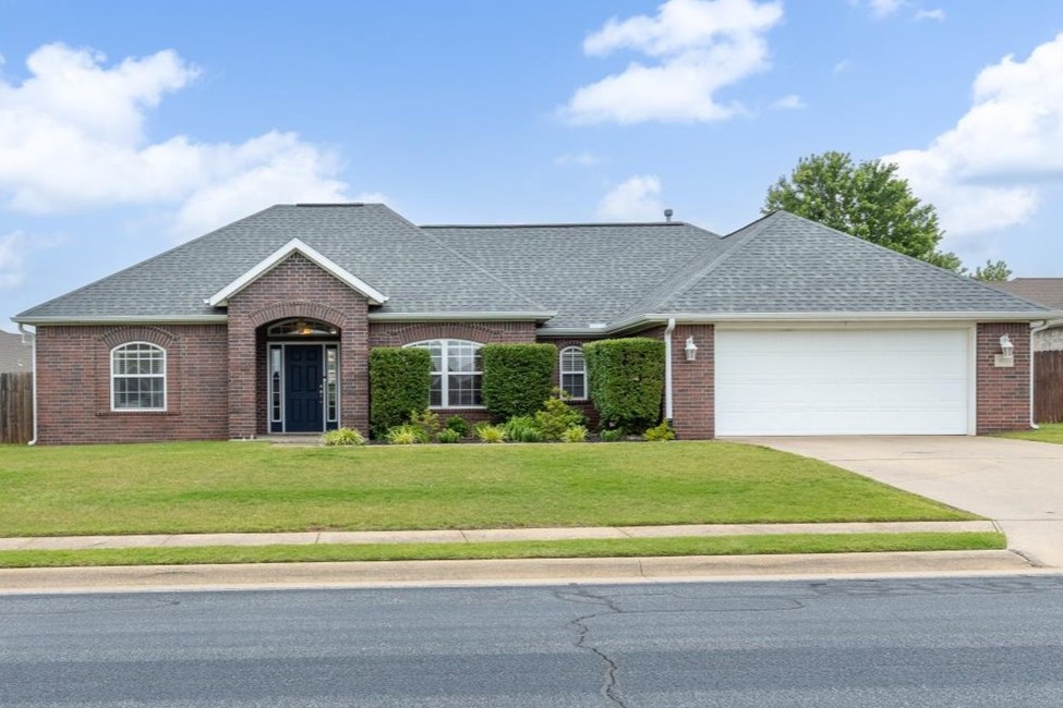 Close to it all and in a charming neighborhood, don't miss a chance to be a part of Cambridge Place! Lovely upgrades in this split floor plan include real hardwood floors and granite countertops in your large kitchen, where your refrigerator stays! Craftsmanship shines throughout with crown molding, stylish baseboards, and beadboard paneling at your breakfast bar. The woodwork trim around your mantle, beam, and doors is not to be missed! Your formal dining room can be reimagined into a playroom, or a music room for your evening lounge time. You master bedroom is complete with a tray ceiling, and a spacious ensuite. Unwind in your whirlpool tub, surrounded by your double vanities. Your charming laundry room has a shiplap wall and lots of natural light. Enjoy your cozy covered patio for your summer grilling adventures. Minutes to shopping, less than 6 miles to J.B. Hunt, under 20 minutes to the new Walmart Home Office, & only 25 minutes to the UofA, this prime location has you living your best life!