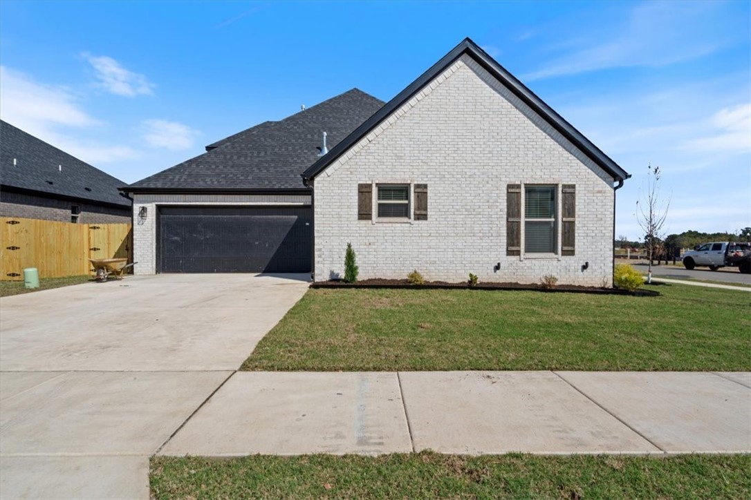 Welcome to your family home in Walnut Grove Estates. This upcoming Bentonville subdivision is located just minutes from Vaughn Elementary, the airport, groceries, gas, & more. This gorgeous home includes so many upgrades. Quartz countertops, custom built cabinets, large kitchen island, built-in wine rack, large closets, split floor plan with 2 bedrooms upstairs, & so much more. The master is a true retreat with a soaker tub, custom tile shower with bench, & oversized walk-in closet. The side load garage on a corner lot makes this even more desirable. Fence & gutters included in purchase price. Neighborhood pool & other POA amenities coming soon.  Seller is offering $10,000 in closing costs, rate buy downs, or appliance upgrade. Preferred lender is offering up to $3,500 towards rate buy down or closing costs.