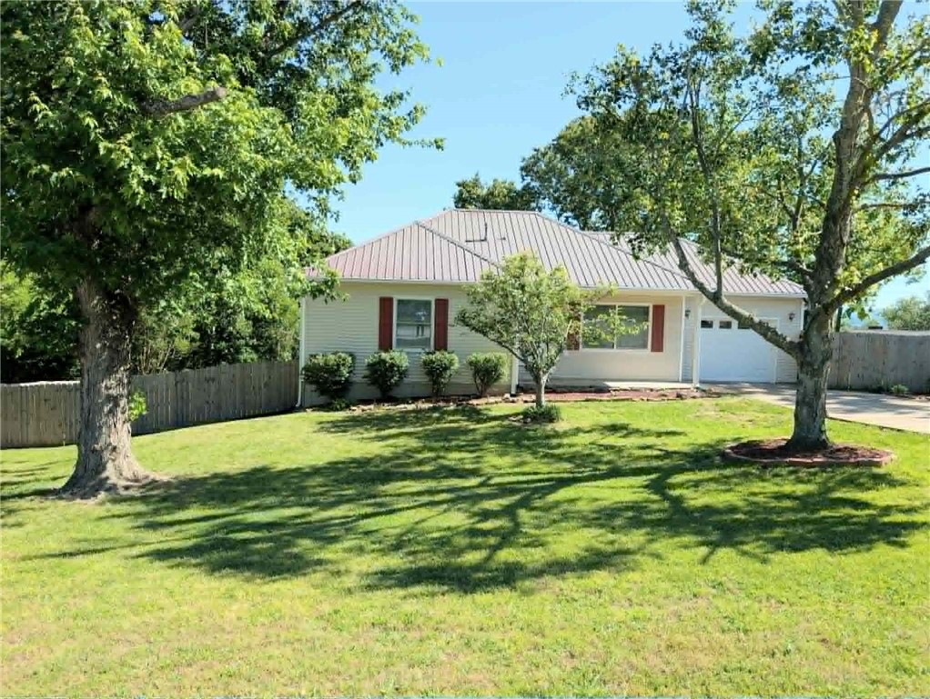 Located in the highly sought-after Cottonwood Landing subdivision, this beautifully maintained 3–4 bedroom, 3 bathroom home offers privacy, functionality, and timeless style in a quiet cul-de-sac setting. New gutters (2025), updated Anderson windows, and custom top-down/bottom-up blinds. This home was designed with efficiency and comfort in mind. The main level showcases elegant tray ceilings, two spacious bedrooms, two full baths, and a stunning glass-enclosed sunroom stretching the length of the home. The walk-out basement provides incredible flexibility with an additional bonus room that could serve as a 4th bedroom with a few adjustments, updated tile shower, cozy den, and a full second kitchen with beautiful pecan cabinetry—perfect for guests or multi-generational living. The furnace and gas water heater were updated in 2018. Outside, enjoy double decks overlooking a large backyard with plenty of room to relax, garden, or entertain. All appliances convey, making this property truly move-in ready.