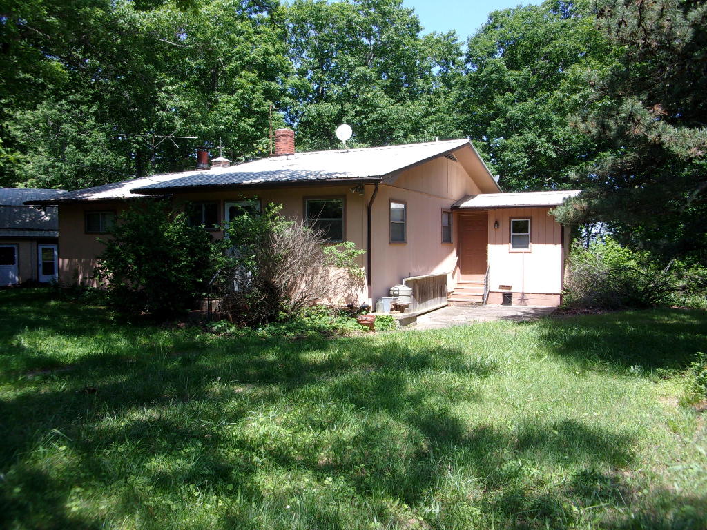 Possibilities abound with this home sitting on 16 acres more or less and just a short drive to Jasper and everything to enjoy in Newton County including the Buffalo National River or the many hiking trails to explore or to just enjoy the beauty at a slower pace. Quiet setting with some elbow room and nice views of the hills. Mostly all wooded with some large trees and plenty of room to expand if needed. 2 bay detached garage with an open 12 x 20 room and 8 x 10 bath with stand-up shower for extra guest on 2cnd level.  2 portable carport units and an 8 x 10 storage shed. Enjoy the outdoors and sunsets at their best from the 10 x 16 screened in covered porch off of living room.