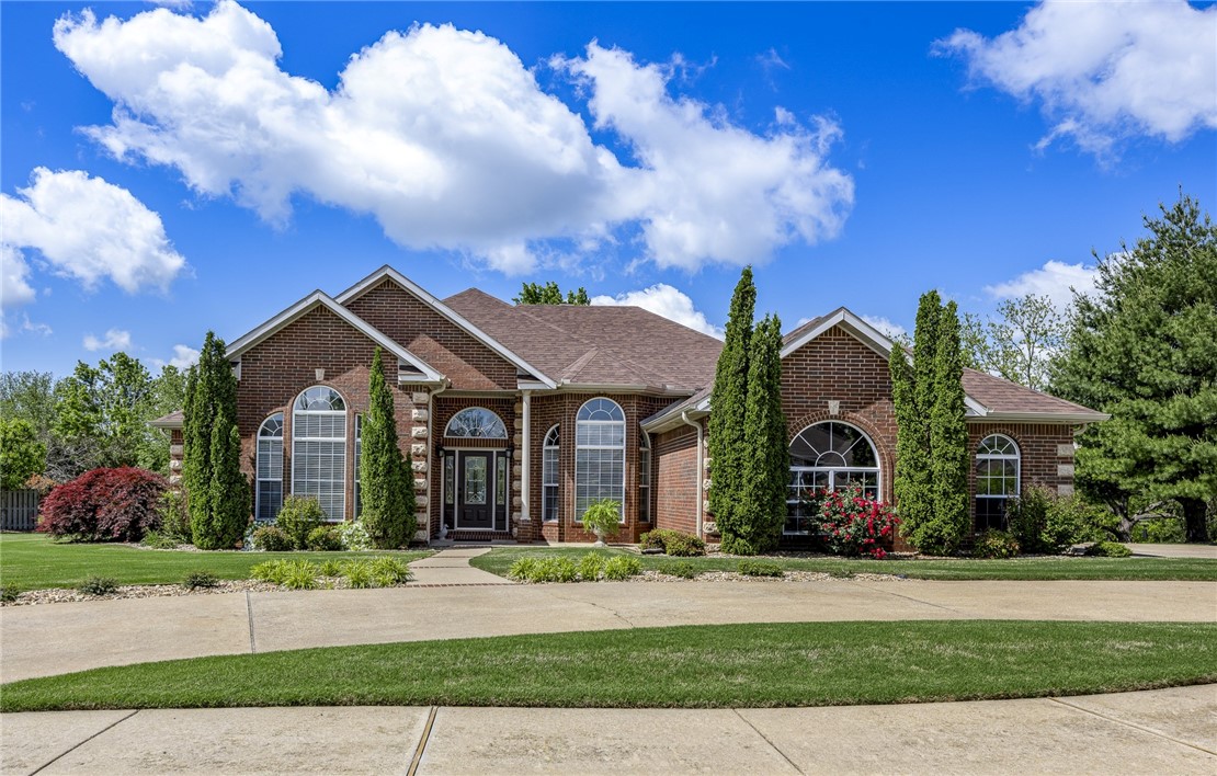 Like New! Updated Throughout! Amazing Location! Walk or bike to Walmart Campus, Downtown Square, Museums, School of Medicine, Orchard Park, Memorial Park. Extremely close to Trails. Less than mile to I-49. In sought-after Glenbrook Subdivision. On .62 acre level lot. Beautiful home. Impeccable condition. All brick, 3 car garage, invisible fence, spacious deck, gorgeous landscaping, abundant natural light, high ceilings, crown molding, tray ceilings. High-end upgrades, new hardwood floors & fresh paint create a sophisticated home, fresh clean relaxing atmosphere. Floorplan allows versatility to enjoy the space based on personal lifestyle. 2 living areas. 2 dining areas. Home office. 4 bedrooms, 3.5 baths. Oversized primary bedroom. Like new bath offers comfort/luxury with walk-in shower, soaking tub, double vanities, double closets. Like new kitchen is modern & bright with stainless appliances, quartz countertops, new backsplash, white cabinets, new lighting. Large laundry room. Several linen closets. Many built-ins