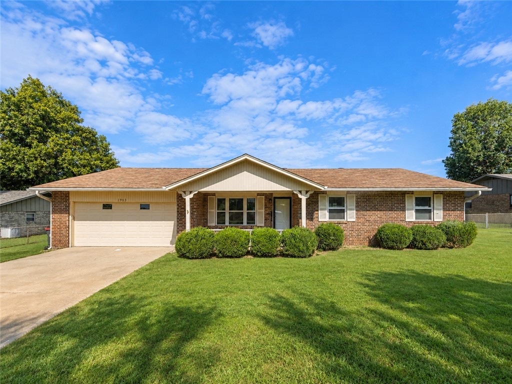 Beautifully updated 3-bedroom, 2-bath home offering 1,524 heated sq. ft. on a spacious, level lot in an established Springdale neighborhood. The oversized living room features a cozy gas fireplace and flows into the dining area and functional kitchen with abundant cabinetry and counter space. Enjoy the large deck overlooking the fully fenced backyard, perfect for entertaining, pets, or family gatherings. A storage building provides additional space for tools, equipment, or hobbies. Major updates completed in 2022 include a new roof, attic insulation, ductwork, flooring, interior paint, toilets, plumbing fixtures, ceiling fans, electrical outlets, and switches. Vinyl windows were installed in 2016. Refrigerator conveys. Conveniently located near schools, shopping, dining, parks, and I-49.