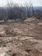 COMMERCIAL TRACT. Property is ready to build on with all utilities at the street. Seller has leveled off about 1 acre at the top to put any type structure on that the buyer chooses.  The view of the River Valley from the front entrance of any building will be beautiful.