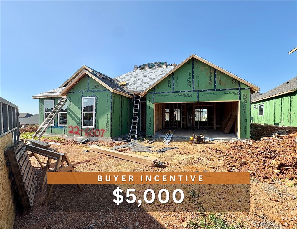 $5,000 BUYER INCENTIVE. Fence, blinds and gutters included! Discover your dream home in the sought-after Osage Hills neighborhood. Arkansas plan with garage on the right and North facing! 10 ft ceilings in the living/kitchen area, linear electric fireplace, 1 level, LVP flooring throughout the main living areas and primary bedroom, quartz countertops and more. Chef's kitchen boasting frigidaire stainless steel appliances, gas range ,pantry, quartz countertops, bar pull handles, large island and gorgeous backsplash. Luxurious primary bedroom features abundant natural light, while the spa-like primary bathroom offers a walk-in shower, double sinks, and spacious walk-in closets. Additional features include two large secondary bedrooms and a separate laundry room. Nestled on a generous lot with covered patio that overlooks the serene sodded, fully fenced backyard. Sturdy concrete siding & brick! Model home located at 6008 SW Coywolf St- Lot 122.