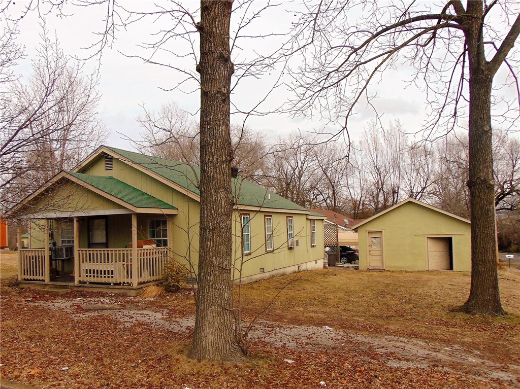 This 3 bed, 2 bath home would be a great place to call home or use as a rental. There is a detached garage, sits on a corner lot, located within walking distance to school and Tyson.
