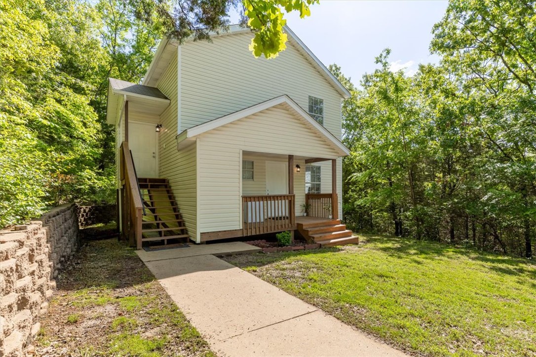 Tucked away on a quiet hillside, this unique 2-story, 4-bedroom, 2-bathroom home offers the perfect balance of privacy and convenience—just 10 minutes from everything the city has to offer.

The functional layout provides versatility throughout. Upstairs features the main living area, including the kitchen, front room, and private primary bedroom, creating a comfortable retreat. Downstairs offers 3 additional bedrooms, a full bathroom, and laundry room, making it ideal for families, guests, or rental potential.

Enjoy peaceful natural views from the backyard, with undeveloped space ready for a garden, entertainment area, or relaxing escape. The cozy front porch with enclosed storage adds charm and practicality.

Perfect as a primary residence, Airbnb, student housing, or long-term rental investment, this hillside gem is full of opportunity. Schedule your private showing today!