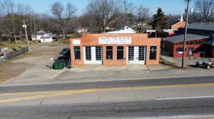 Introducing a prime commercial opportunity in downtown Clarksville, AR! This expansive multipurpose building boasts 3,696 sqft of versatile floor space, a secure fenced side, ample parking, and two sets of large sliding glass garage doors. The property includes a spacious office with a bathroom and convenient loft storage. Ideal for diverse business ventures, this property offers a dynamic space in a thriving location.