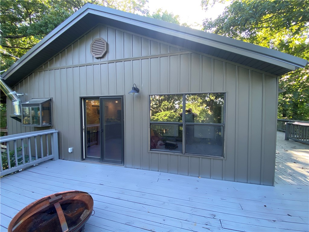 Escape to the heart of the Ozarks with this exceptional home on 29 acres in the Gather Basin near Tom Thumb Spring in the historic Erbie community of Newton County, Arkansas. Surrounded by natural beauty, the property has an incredible wet-weather waterfall system and existing native log roads. Only 6 miles from the Buffalo National River in the Ozark Mountains. The home features beautiful hickory flooring, steel siding, new metal-clad electrical wiring, custom kitchen island and a full bathroom with tiled walk in shower and claw foot tub. Full, partly finish, basement which is plumbed for an additional full bath. Underground electric and on rural water. Relax year-round in the screened-in hammock roost or entertain on the expansive 720-square-foot deck overlooking the peaceful landscape. Whether you're seeking a private residence, weekend retreat, or outdoor paradise, this rare property offers unmatched serenity, craftsmanship, and direct access to one of the most scenic areas of the Arkansas Ozarks.