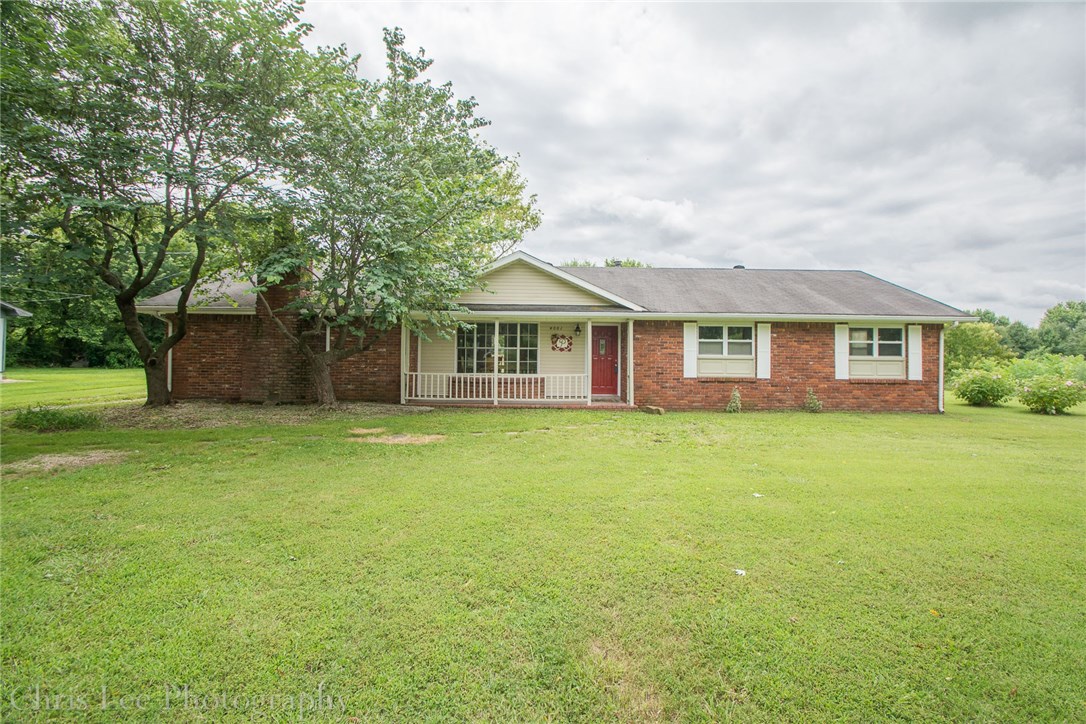 Almost completely remodeled with new hardwood flooring, new textured walls & ceiling, new kitchen cabinets, new light fixtures, concrete counter tops in kitchen and much more! 2 living areas. Large den boasts wood insert fireplace. Formal dining room. Large kitchen pantry. Two 1/2 baths (off den & off master BR). Over 400 SF deck! Detached 24x20 garage/shop with 2 overhead doors & 220 volt electric. Storage build that includes cool storage (cooler needs work). Large garden area. Just outside city limits!