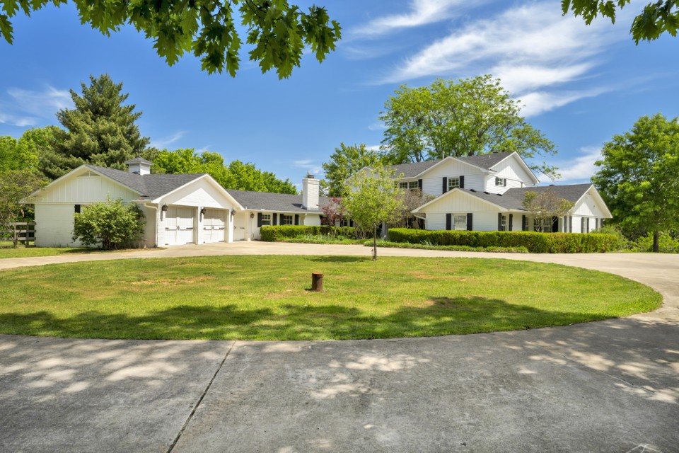 Beautifully designed 5-bedroom home offering space, comfort, and versatility across 5,152 sq ft. This two-level property features 4 full baths and 2 half baths, with a thoughtful layout ideal for both everyday living and entertaining. Enjoy multiple living areas including two spacious living rooms, a dedicated study, and a large upstairs bonus space. The kitchen showcases rich alder cabinetry, walk-in pantry, and abundant storage throughout the home. Three fireplaces add warmth and character, creating inviting spaces to relax and gather. Step out back to a generous screened-in porch measuring 14'9 x 18'11, perfect for enjoying the outdoors year-round. Situated on private, level acreage with an organic garden and abundant wildlife, and a 3-car attached garage plus an impressive 3-bay shop, ideal for RV parking or additional workspace. A truly beautiful home with room for everything, inside and out.