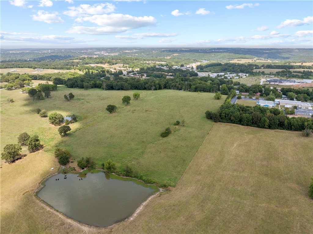 Prime development opportunity in Harrison, AR! This 18-acre tract is your chance to develop in one of Harrison’s most accessible and visible locations. Zoned R3, this property also includes architectural plans and blueprints already completed for a 30-unit apartment complex—a significant value that saves both time and cost in the planning phase! Location is a key advantage. Just 0.25 miles off US 62/65, the site provides immediate access to one of the region’s busiest highways, while sitting less than a mile from North Arkansas College. Making it an ideal fit for student housing, workforce housing, or other rental-focused projects to meet strong local demand. Currently open pasture, the land is straightforward to build on and offers flexibility for developers and investors. Whether you proceed with the existing apartment plans, explore senior living, or pursue other commercial or multifamily options, this property delivers the visibility, zoning, and market demand to support a successful project.