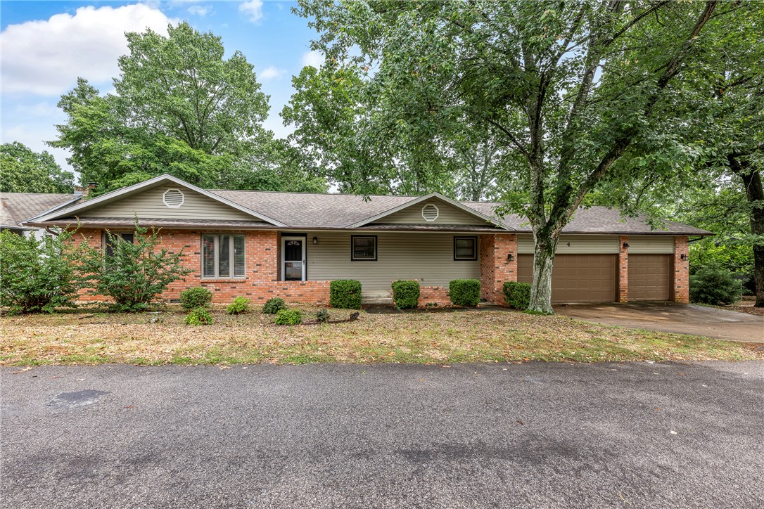 Affordable homes with a level driveway and a 3-car garage are rare. This well-maintained home features 2 bedrooms plus an office with a closet and is ideally located near world-class mountain biking, Buck Trailhead, and the Back 40 trails.  The kitchen offers pantry, ample workspace, granite countertops, and all appliances currently shown will convey. Enjoy the rear deck for morning coffee or relaxing in nature, along with a spacious, level side yard perfect for pets or play. The property also provides easy access to the Metfield recreation area and Highway 71 at the stoplight. With only minor updates, this home has the potential to become a dream property. Recent improvements include new siding in 2022, a new roof in 2024, and a new dishwasher in 2025. The purchase price also includes a 2-10 home warranty. Septic design is a 2 bedroom.