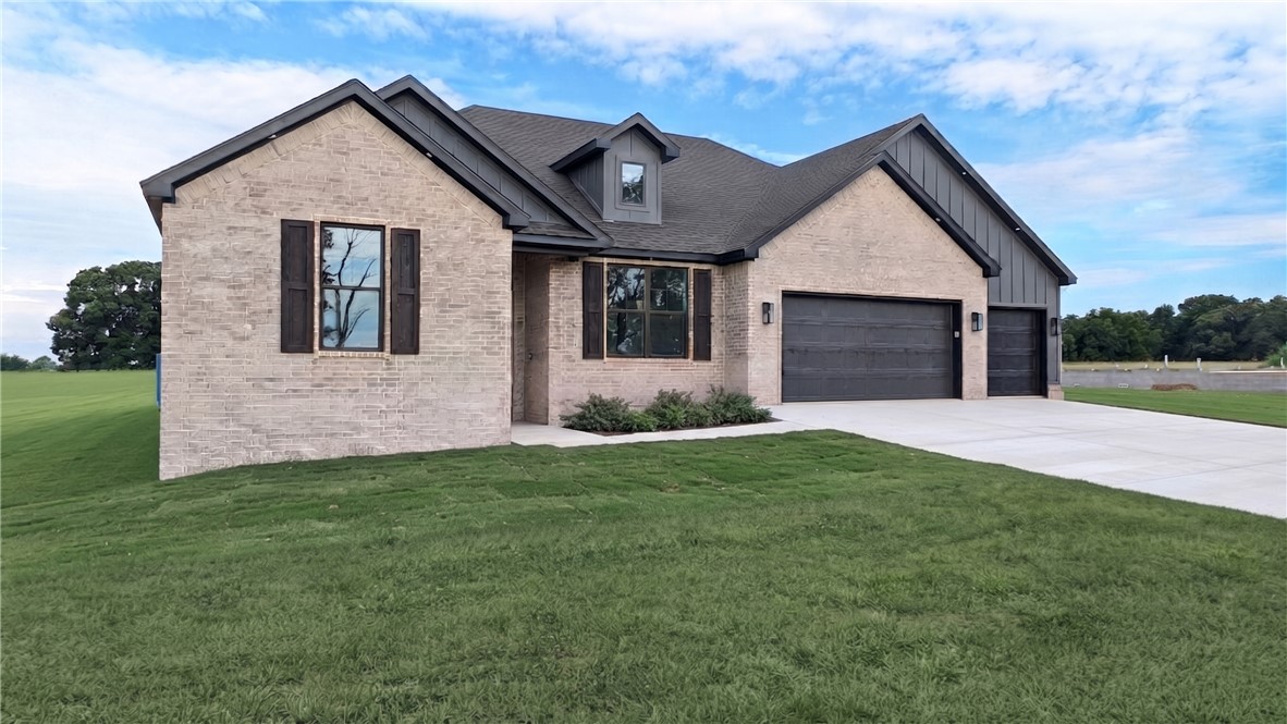 Perfectly positioned on a beautiful 1 acre lot just minutes past XNA, this stunning custom home perfectly blends modern luxury, high-tech convenience, and ultimate peace of mind. The open-concept living space immediately captivates with soaring vaulted ceilings, striking exposed wood beams, and a cozy stone fireplace. A chef’s dream, the gourmet kitchen boasts a premium gas cooktop, elegant stone countertops, and an expansive island. The luxurious master suite serves as a private oasis, featuring a deep soaker tub and a custom tile shower, complemented by an equally impressive custom guest shower. Designed for modern living, the home is fully equipped with network cabling throughout and is prewired for sound. Unmatched security is built right in with a certified indoor Atlas safe room. Complete with an attached 3-car garage and a spacious covered patio overlooking your oversized lot, this property offers an unbeatable location and premium finishes at every turn!