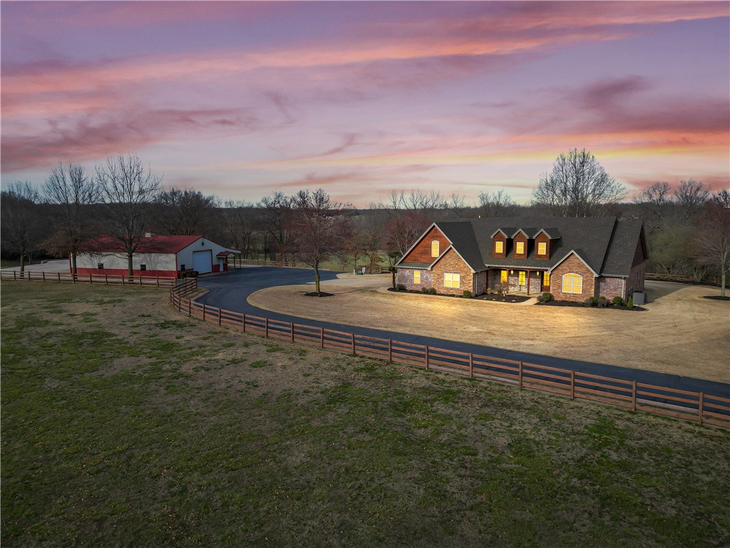 Amazing estate property! Location is convenient to Farmington or Fayetteville! The home sits on a manicured 10 acres mol with multiple outbuildings and overlooks a beautiful valley! This custom built 1 owner home has a great layout for large families or entertaining! The living area is open concept and the bedrooms are huge! Too many amenities to list so come see this for yourself! The setting and location is second to none! Shop building is 40x60 and it includes lean-to stalls and also a separate pole barn. Total Acreage amount 10.11.  Parcel ID# 760-02374-012 (5.40), #760-02397-001(2.66 acres),#760-02374-011 (2.05 acres). The riding arena and shed do not convey.