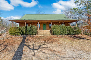Show stopping home! Beautiful private home with a perfect country cabin feel with gorgeous modern touches. Stunning floor to ceiling fireplace, cathedral wood ceilings. Beautiful flooring 4 bedrooms and 3 full baths this home is perfect for a large family or a great B&B with its one of a kind touches. Don't miss the custom feeling fixtures throughout the home. Nice SHOP and second storage shed in the back all on 20 plus acres. The owner is offering a flooring allowance to update the bedroom flooring, the rest of the house has beautiful wood and tile.