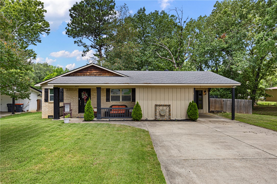 Welcome home to this charming 3-bedroom, 1.5-bath residence offering 1,651 square feet of comfortable living space in a convenient central Russellville location. Inside, you'll find fresh paint throughout, updated baseboards, a spacious additional living area, and a cozy wood-burning fireplace that creates a warm and inviting atmosphere. Recent improvements include a new vanity in the primary bathroom and replaced crawl space vents, while the fireplace has been serviced annually for peace of mind.

Step out front to enjoy the inviting covered front porch, or out back to a spacious deck and beautifully fenced backyard—perfect for relaxing, entertaining, pets, or play. Situated in a neighborhood with minimal traffic and easy access to schools, shopping, dining, and everyday conveniences, this home offers the perfect blend of comfort, character, and location.