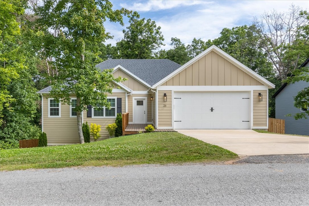 Welcome to this lovely one level home that is settled amongst the trees on a spacious .43-acre privacy fenced yard. Enjoy outdoor spaces with low maintenance decks in the front and back of the home. Inside, you’ll love the thoughtfully designed floor plan with an office or 4th bedroom up-front, and a split plan with the remaining bedrooms. The designer kitchen has under cabinet lighting, pantry, soft close doors and drawers, stainless appliances, and designer finishes. A luxurious primary offers vaulted ceiling, double vanity, enclosed toilet, jetted tub, and walk in shower. Natural light floods the living space where you will enjoy the electric fireplace, wainscotting, five panel modern style doors, and LVP flooring. Close to Bentonville Color trails and zoned for Bentonville Schools.