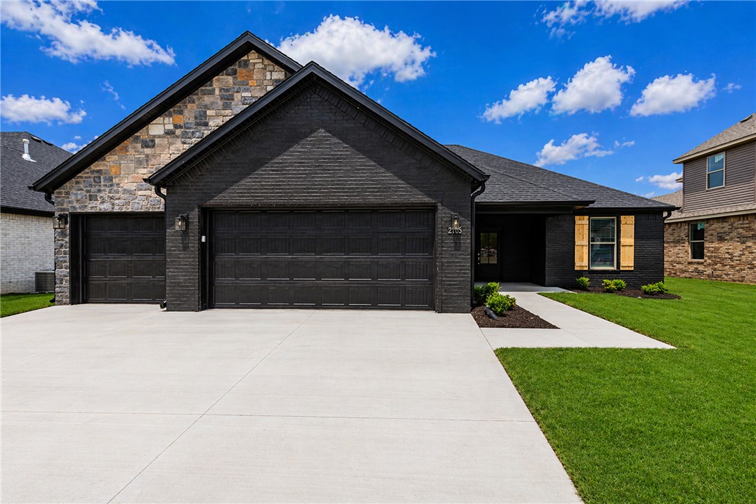Welcome to this beautiful new construction home in Siloam Springs! This thoughtfully designed home offers a custom interior and exterior design of modern living space with quality finishes throughout. The exterior features classic brick construction, a 3 car garage, & an inviting curb appeal, while inside you’ll find luxury vinyl plank flooring, an open & functional layout, & abundant natural light. The kitchen is equipped with quartz countertops, energy star appliances, eat-in kitchen space, & ample cabinetry. Enjoy outdoor living on the patio. Don’t miss the opportunity to own this move-in-ready new construction home in a growing Siloam Springs neighborhood!