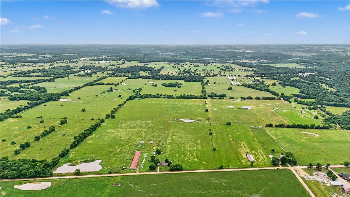 Nestled on the Arkansas/Oklahoma line, this beautiful 92.22-acre family farm offers lush grazing land, multiple pastures, and endless possibilities for farming, ranching, or country living. The property features a solid ranch-style home with plenty of space and comfort, all set against peaceful rural surroundings. With excellent highway access, this well-maintained farm combines convenience with the charm of wide-open spaces, making it an ideal opportunity for livestock operations, a family homestead, or a private rural retreat.