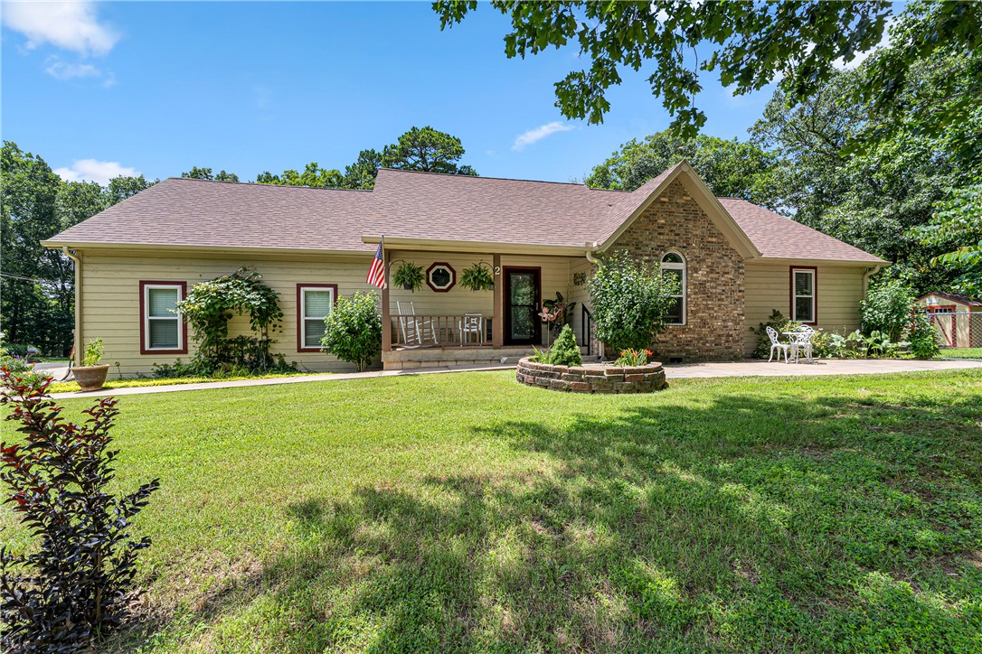 Well-maintained and move-in ready 3-bedroom, 2-bath home offering the perfect blend of comfort, privacy, and outdoor living. Tucked among mature trees and within walking distance to Flo Ride biking trail, you’ll love the peaceful setting, backyard oasis, and refreshing above-ground pool. Relax on the spacious deck, entertain friends and family, or enjoy the added privacy and potential of the adjoining 0.38-acre lot which is available for purchase.

Updates within the last six years include: roof, gutters, garage door & motor, LVP flooring, water heater, water purification system, guest bathtub & surround, primary shower & surround, paint, garbage disposal, ADA-height commodes & a storage shed. Concrete slab with a dedicated electrical hookup for hot tub is already in place.

Located in Bella Vista, you’ll enjoy convenient access to the area’s renowned trails, lakes, golf courses, parks, and recreation