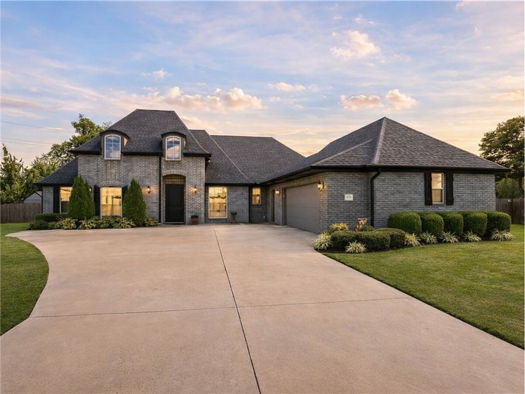 The one you've been waiting for. Step into an inviting, well-appointed 4 bed/3 bath single-level home offering 2,825± SF on a spacious 0.42± acre cul-de-sac lot in Rogers. Enjoy a prime in-city location near shopping, schools, hospitals, dining, and trails—plus it’s right by the Blossom Way Trailhead for easy outdoor access. Inside, you’ll find a split floor plan with cathedral ceilings, a cozy living-room gas-log fireplace, and a kitchen designed for everyday ease with granite counters, pantry storage, and built-in appliances. A dedicated library/study/office adds the perfect work-from-home or flex space. Step outside to your private backyard retreat featuring a vinyl in-ground pool, patio/porch, and a blend of iron/wood fencing. Noted updates include roof (2019), HVAC (2018), pool liner and multiport valve (2025), resurfaced primary tub, French drain, floored attic space, additional gates, and more—thoughtful improvements that elevate comfort and peace of mind.