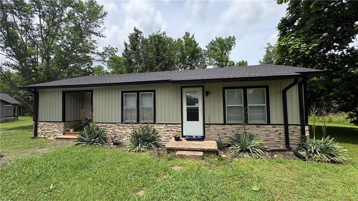 3 Bed/1 Bath House on 0.63 acres (M/L) - Dardanelle, AR

-This recently updated 1,100 sqft 3-bedroom 1-bathroom single-level home offers modern style, a functional layout, and a peaceful setting surrounded by mature trees. The exterior features vertical siding, stone accents, and black-trimmed windows for standout curb appeal. Inside, the home includes wood-style flooring, neutral paint, and a spacious living area that flows into a fully updated kitchen.

-The bedrooms are comfortable and well-sized, and the bathroom is clean and modern with organized storage. A dedicated laundry area with overhead cabinets adds convenience.

-Outside there is a large back deck overlooking the yard—perfect for grilling, relaxing, or outdoor play. Located right at the base of Mount Nebo, this home offers quick access to scenic overlooks, hiking trails, and outdoor recreation just minutes away. The home is located at the bottom of hays creek mountain bike trail and connects to miles of monument trail on Mount Nebo.