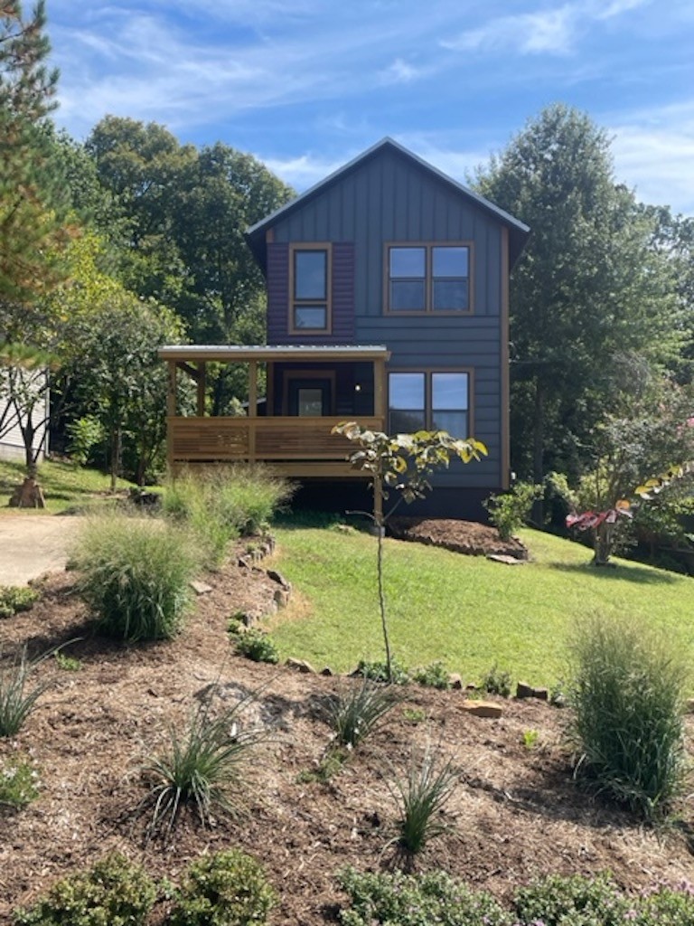 Very unique, modern 3 bedroom, 2 bath home, two bedrooms upstairs with one bedroom on the lower level with access to deck and hot tub. Minutes to Dickson Street and U of A, private deck in front for enjoying your morning coffee. Double lot, hot tub, appliances include, stove, refrigerator, dishwasher, washer & dryer- Sorry-No pets & No smoking