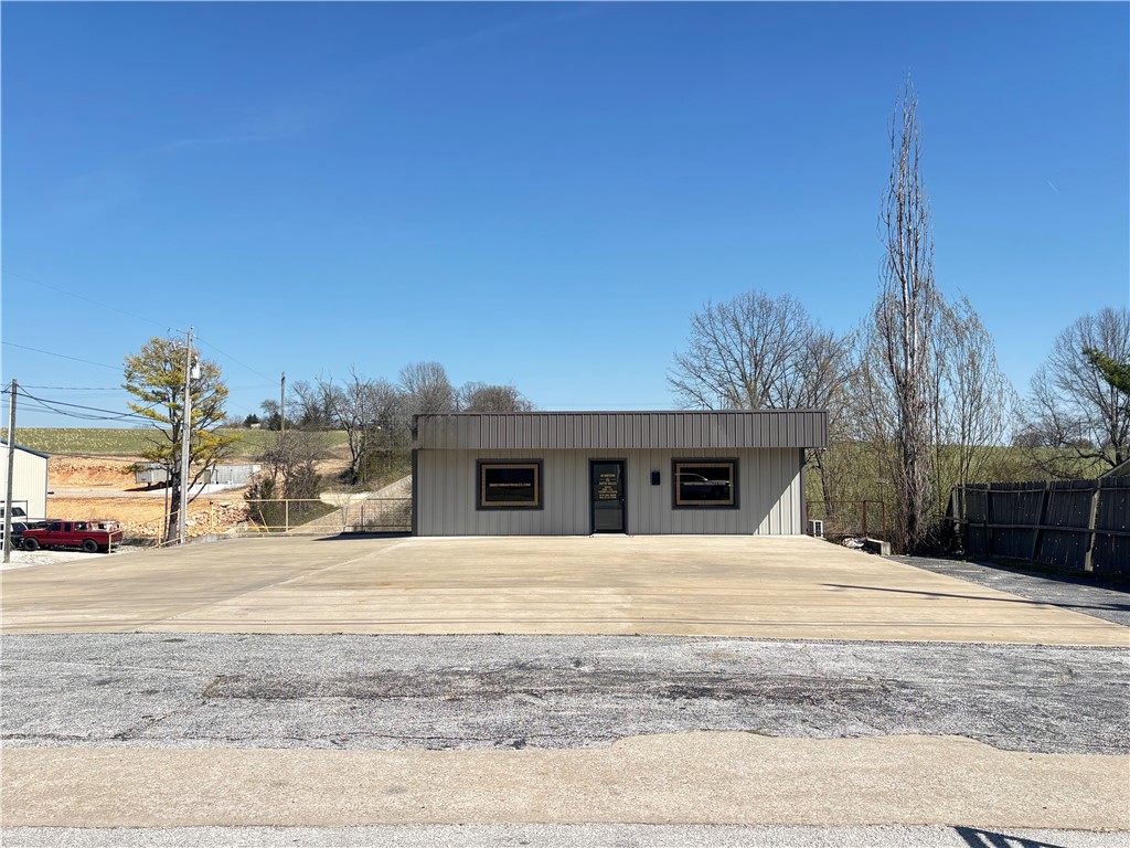 Exceptional commercial opportunity at 2025 Highway 7 North in Harrison, Arkansas. Situated on approximately 0.50 acres at the intersection of two major highways, this highly visible corner lot offers outstanding exposure, easy access, and excellent traffic counts from multiple directions.

The main sales floor building was constructed in 2018 and provides a modern, professional space ideal for retail, showroom, office, or customer-facing operations. The property also includes a heated and cooled shop building featuring two large overhead doors, offering flexibility for service work, equipment storage, inventory management, contractor operations, automotive-related businesses, and other commercial uses.

Additional features include a surveillance system for added security and peace of mind. With its prime location, modern improvements, functional layout, and exceptional visibility, this property is well suited for owner-operators, expanding businesses, or investors seeking a premier commercial location.