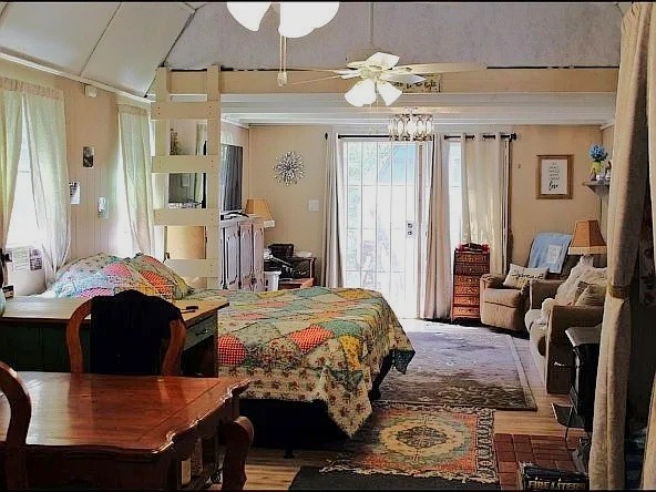Off-Grid Living at Its Best! Enjoy complete independence with no monthly utility bills, no property restrictions, and the peace and privacy of the Ozark Mountains. This nearly new 14' x 44' Derksen cabin features extra-high ceilings, two lofts, solar power, a water catchment system with 750-gallon storage, full kitchen, full bath, propane cooktop, Ashley wood stove, dual Hunter ceiling fans, and comes fully furnished with the personal property needed for off-grid living. A 10' x 20' insulated and wired Derksen building offers heat, flooring, and two lofts for additional living space, a guest retreat, hobby space, or storage. Property also includes a 14 KW Generac propane generator, two 1,000-gallon propane tanks, new Rheem propane water heater, 10' x 40' greenhouse, raised garden beds, chicken coop with chickens, firewood, seasonal creek, pergola with water collection roof, and double-gated access. Move in and start living independently!