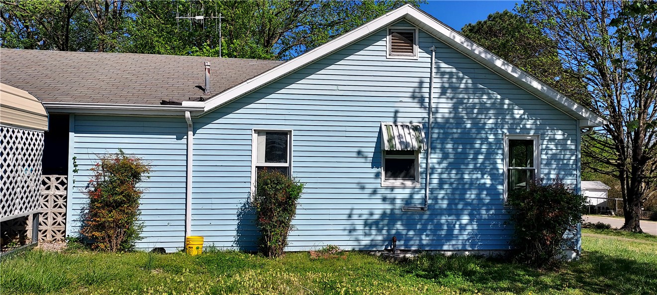 As Is Where Is. With a little vision this could be a very nice little house. Corner lot with a nice sized yard. Very convenient to all Harrison has to offer. Come take a look won't last long. Buyer to verify all numbers & utilities.