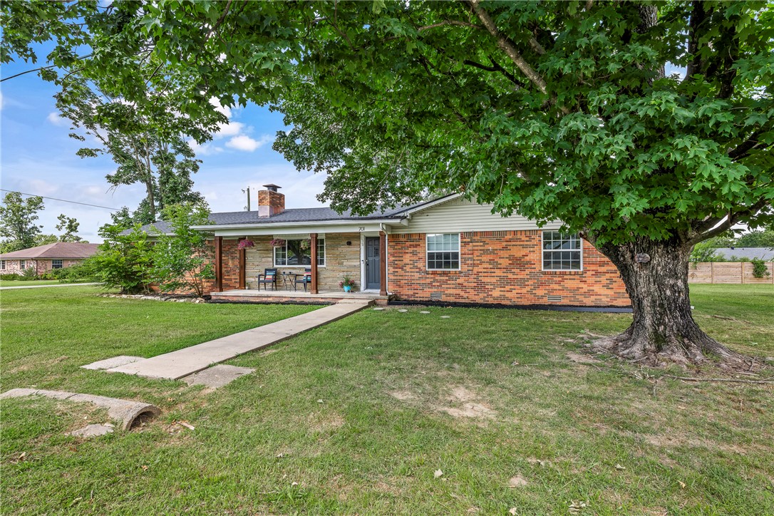Hip, updated, mid-century home in the heart of Bentonville! Just a 5-minute bike ride to Downtown Bentonville and one block from the North Walton Trail, you'll have quick access to the Bentonville Dog Park, Slaughter Pen, Coler, restaurants, shopping, and everything that makes Bentonville one of the best places to live. Originally built in 1969, this home blends mid-century character with modern updates, including a new roof, updated flooring, refreshed kitchen, stylish lighting, and more. Inside you'll find 4 bedrooms, 3 full baths, two spacious living areas, a cool wet bar in the family room, and a classic mid-century fireplace that adds warmth and personality. Whether you're looking for a primary home, rental, or investment property, this move-in-ready home offers the perfect mix of location, character, and Bentonville lifestyle.