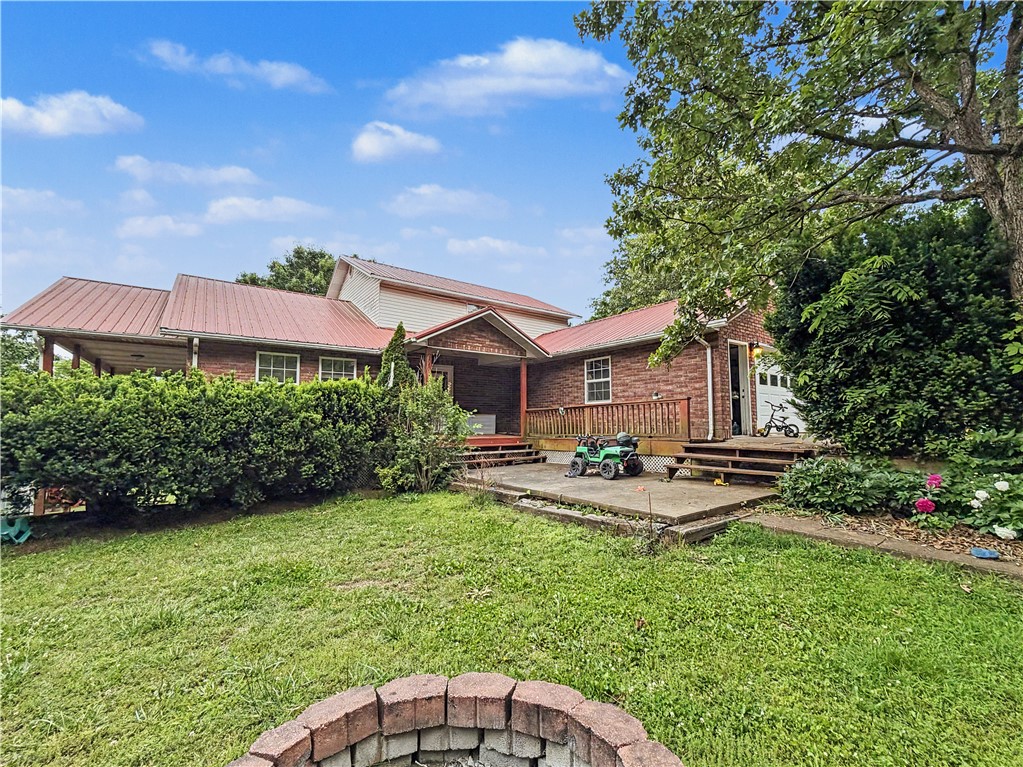 Located just minutes from the beautiful waters of Bull Shoals Lake, this spacious 5-bedroom, 3.5-bath home offers the perfect blend of comfort, updates, and country living. Situated on approximately 0.99 acres in the peaceful hills of Lead Hill, this property provides plenty of room for family, guests, or even a vacation getaway near the lake. Inside, you’ll love the open-concept layout, finished basement with a second kitchen and laundry area, and a spacious primary suite complete with redone shower. Recent updates give the home a fresh, move-in-ready feel, including new vinyl flooring throughout much of the home, fresh interior paint, and a brand-new HVAC system installed in 2025. Additional major improvements include a water softener and updated well pump, both completed in 2021, offering peace of mind for years to come. The home also features a covered deck, metal roof, attached garage, and an outbuilding for additional storage or workspace.