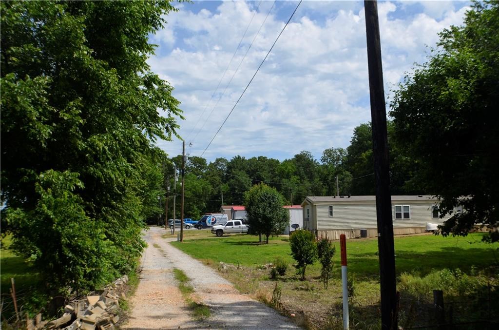 5 lot mobile home park on 1.32 Acres.  This makes a good income and is centrally located between Gentry and Siloam Springs.