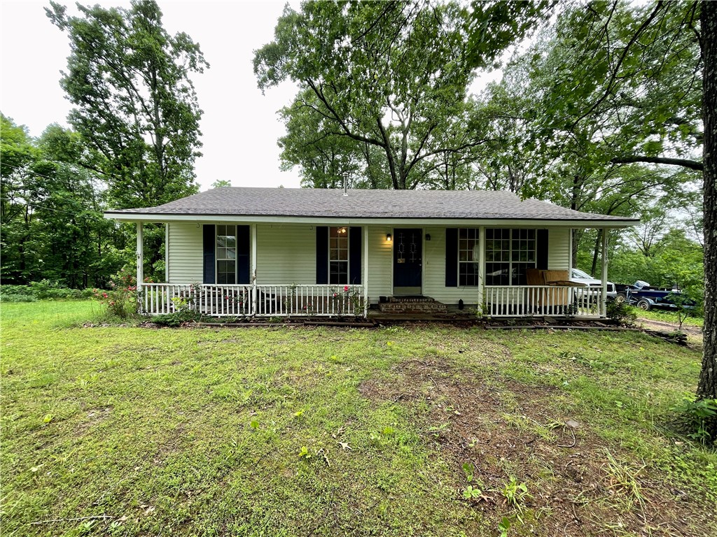 Just starting out?  Want quiet living outside of town?  Looking for nearby lake access to launch your boat?  Head out to the Beaver Lake/Nob Hill area just up the road from War Eagle Park & Boat Launch.  Enjoy beautiful lake views on both sides of the drive across the top of the ridge to the property.  Sitting at the end of a quiet cul-de-sac, the lot offers mostly level usable space just under an acre - a perfect spot for boat & contractor trailer parking.  16x11 workshop with electric. Great potential inside awaits your personal touches - Seller is offering $3500 toward cosmetic updates or buyer closing costs - your choice!  40 x 6 Rocking chair front porch & 15 x 20 back deck for enjoying the outdoors.  Plenty of sun & space for a garden!  Seasonal peek-a-boo views of Beaver Lake in the back.  Bring your vision & start sprucing up this cozy place to make it home!  **Pictures taken prior to move in - looks mostly the same but will need some freshening and repairs**