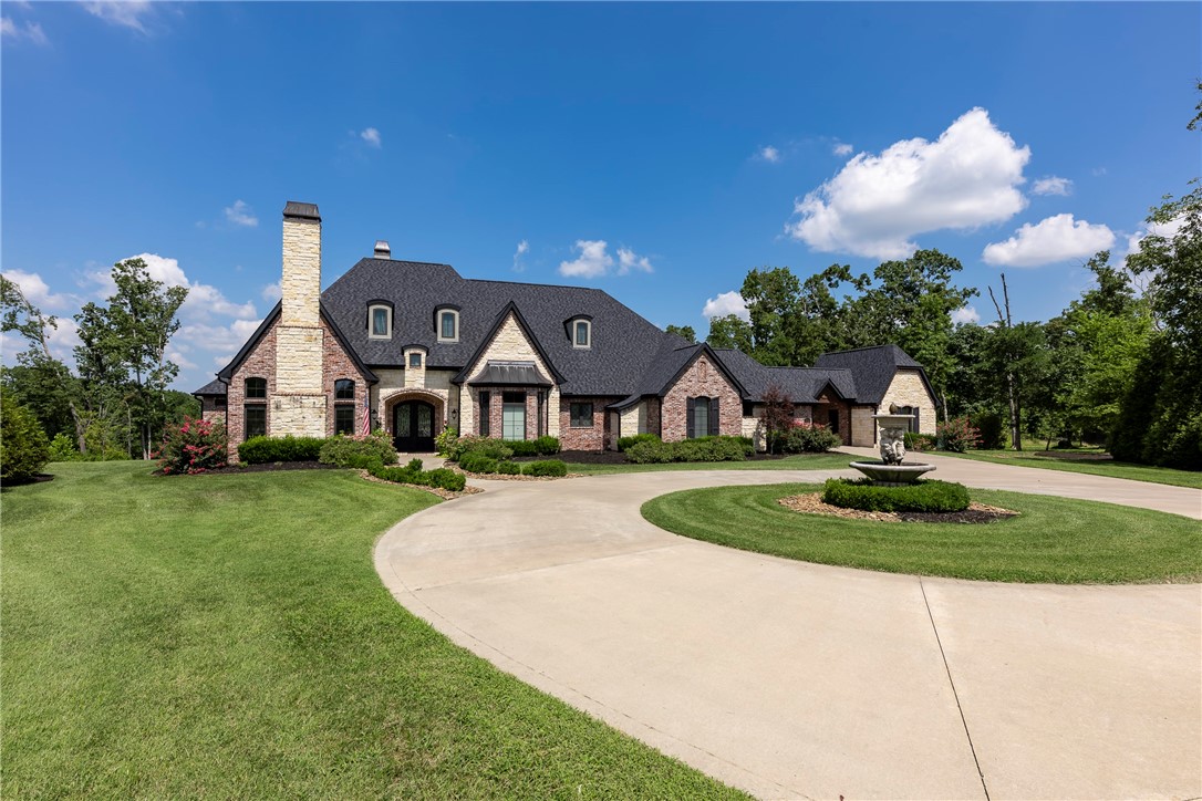 Custom Built-Estate on 4.83 acres in the sought-after Copper Ridge Subdivision!  Quality and High-End Features throughout this spacious and sprawling open layout featuring hardwood floors, granite counters, 12' ceiling, wainscoting, built-ins, coffered ceilings & more! Multiple Living and Entertaining Areas!  Large Living Room flowing into another sunny sitting area overlooking backyard with access to another outdoor living space!  Fabulous Media Room on Main Level, Stunning Home Office/Library with Fireplace and Built ins.  Chef grade kitchen features Blue Star gas range, touch tech faucets, pantry, island & more!  Private Master Suite with spa-like bath w/soaking tub, walk in shower, Oversized Hers closet w/separate shoe closet & vanity!   Three more guest BRs on main each w/bath access.  Upstairs is a Massive Bonus Room w/ wet bar, bathroom & office/craft room.  Outdoor features almost 5 AC of property w/seasonal stream. 3 car garage w/full bath accessible from backyard. 4th car detached garage.