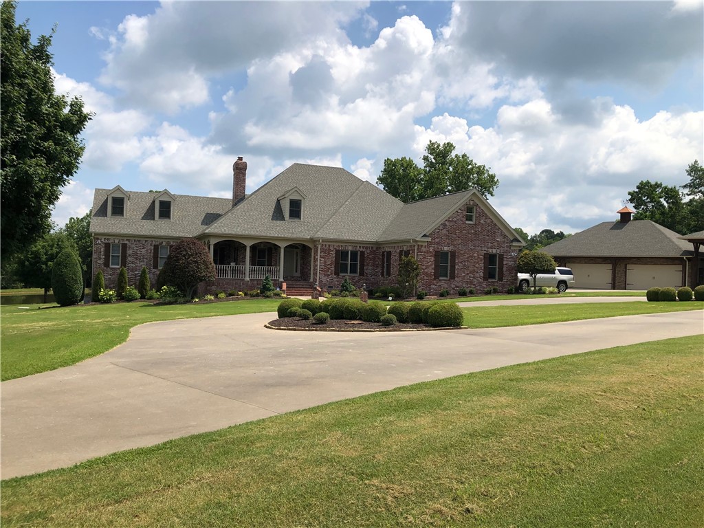 You must see this gorgeous family estate on 5+ acres at the end of cul de sac! Kitchen includes large island, granite countertops, stainless appliances, fireplace, 10' ceilings. Outdoor living space includes screened porch with view of the pond. Spacious living areas. Enjoy downstairs living area with fireplace, kitchenette, full bath and new carpet. It also includes a large room for workout and play room. Bonus! Extra large 4 car detached garage, upstairs bonus room, and RV covered storage. Move in Ready!!